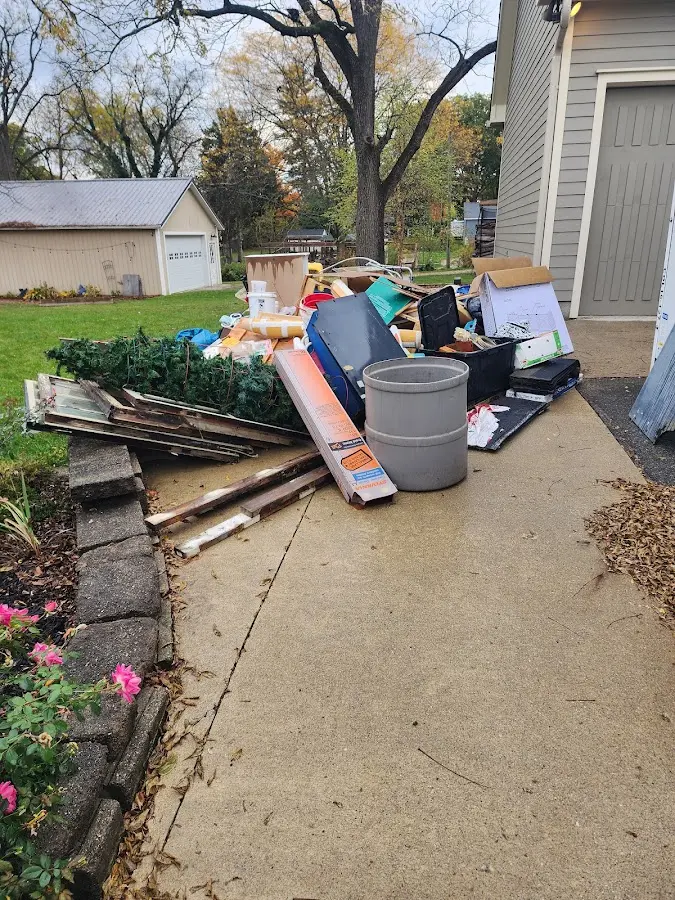 Dumpster being loaded with debris for 10 Yard Dumpster Rental in Mulvane